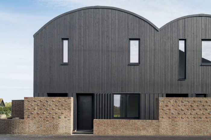 Barn homes shaped like Dutch barns