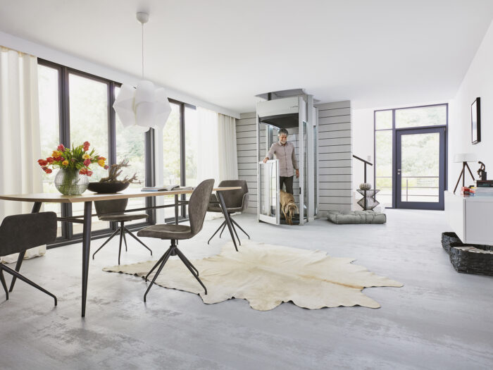 A dining room with a small lift in the corner