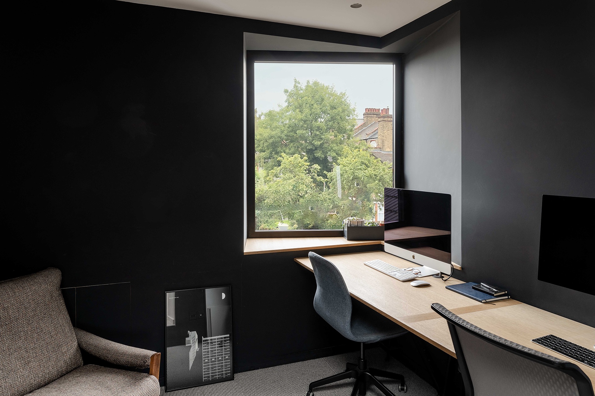 The office in the loft with its tilted window