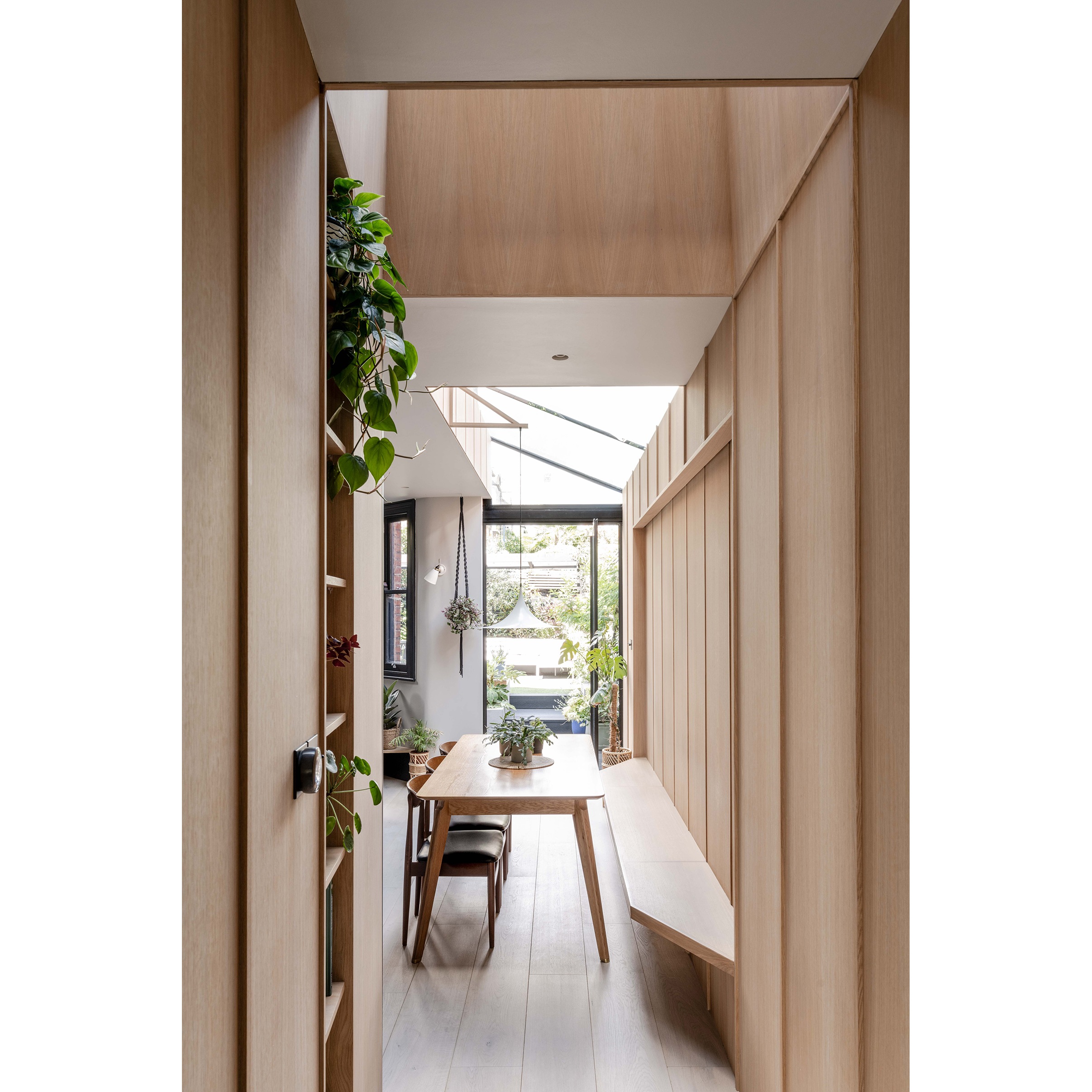 The new extension featuring light well, glass roof, oak panel and view through to the garden