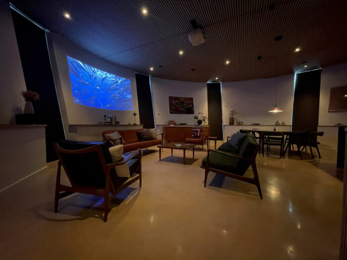 Projector showing a film in the living room at the tower