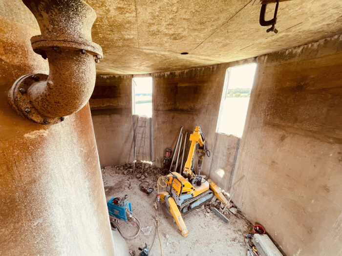 Cutting holes in the concrete tank at the tower