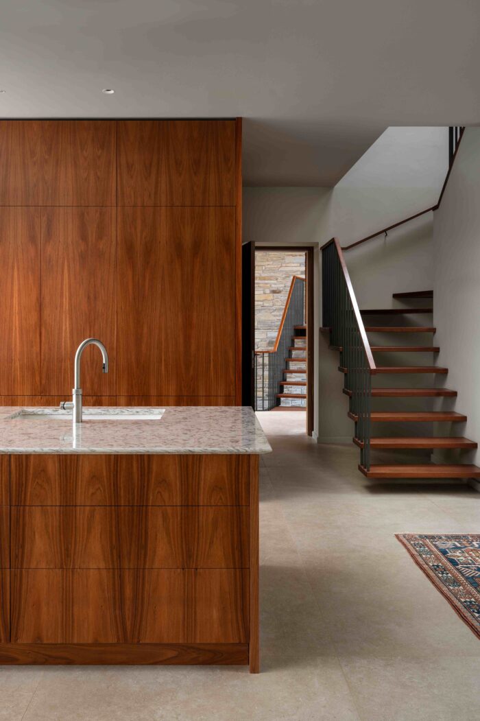 The kitchen appears like a solid piece of wood, with a secret door to the utility room. 